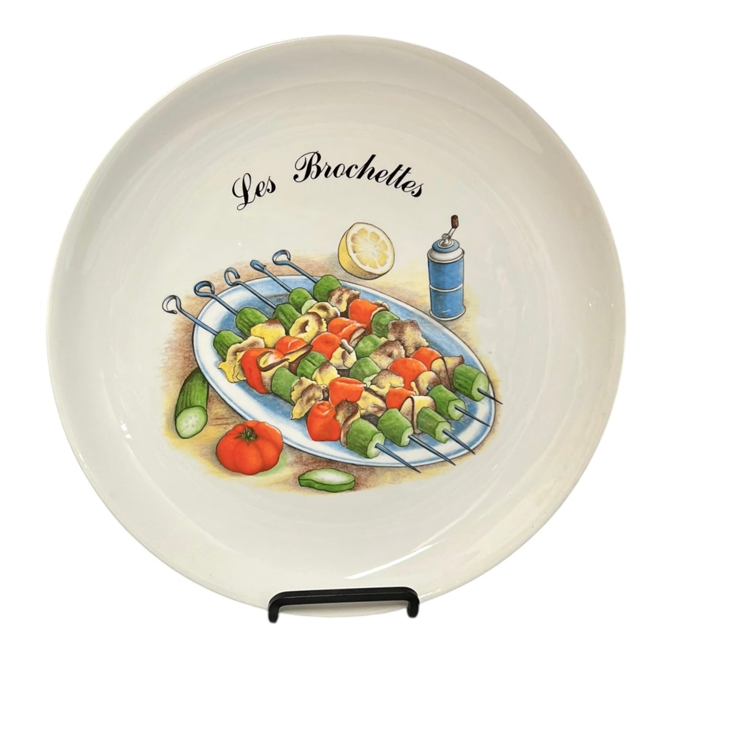 Decorative plate with skewered vegetables and 'Les Brochettes' text on a white background