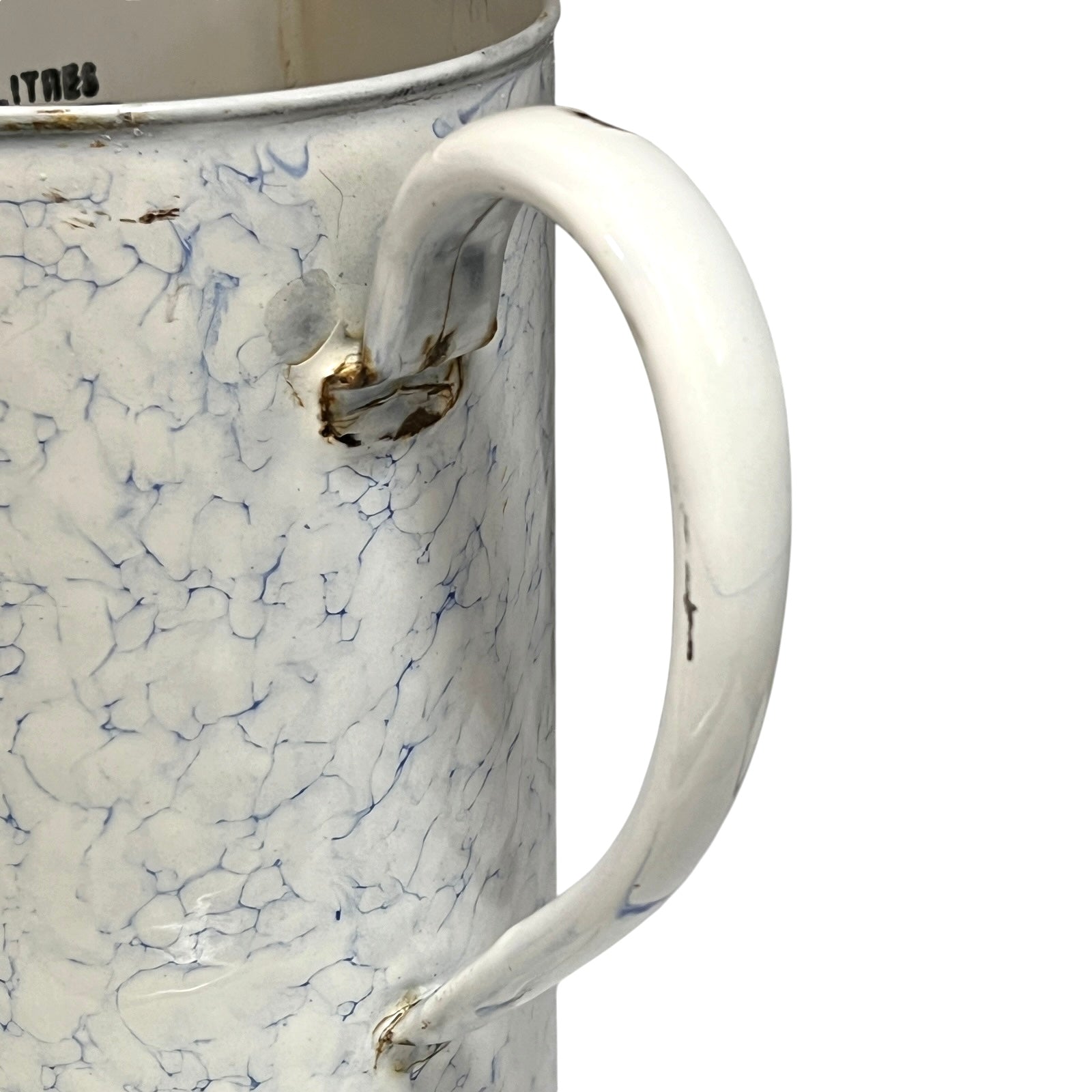 A close-up of a vintage enamel pot with a white handle and body, featuring a blue crackle pattern and distressed brown details near the rim and handle attachment.