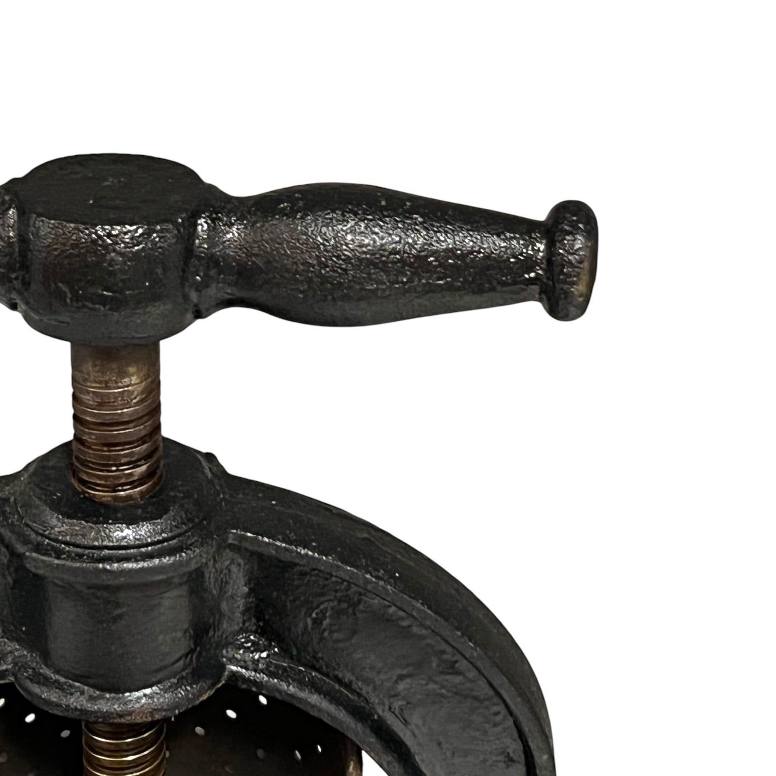 Close-up of a black metal clamp on a white background