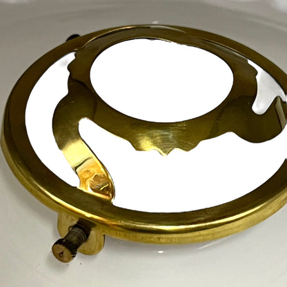 Brass light fitting on a white background