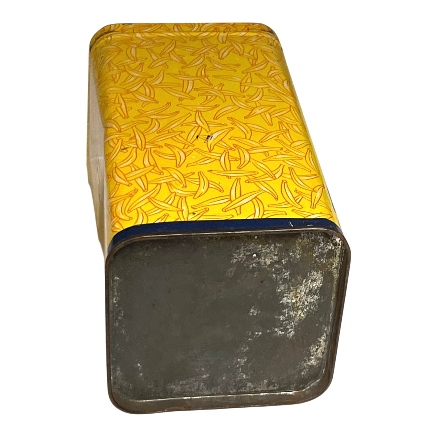 Rectangular metal container with yellow patterned lid on a white background