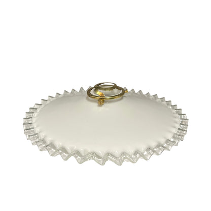 A round white glass lampshade with a scalloped, fluted edge and a small gold-tone ring handle on top, shown against a plain white background.