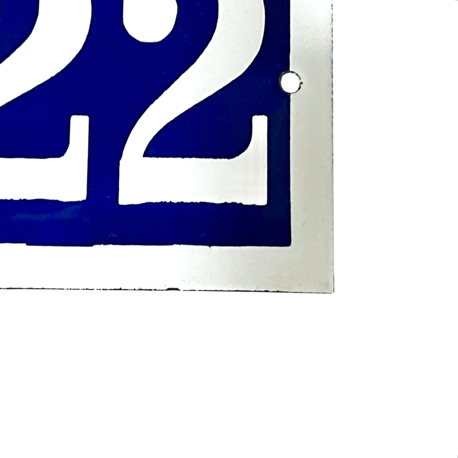 Close-up of a blue and white number  on a white background
