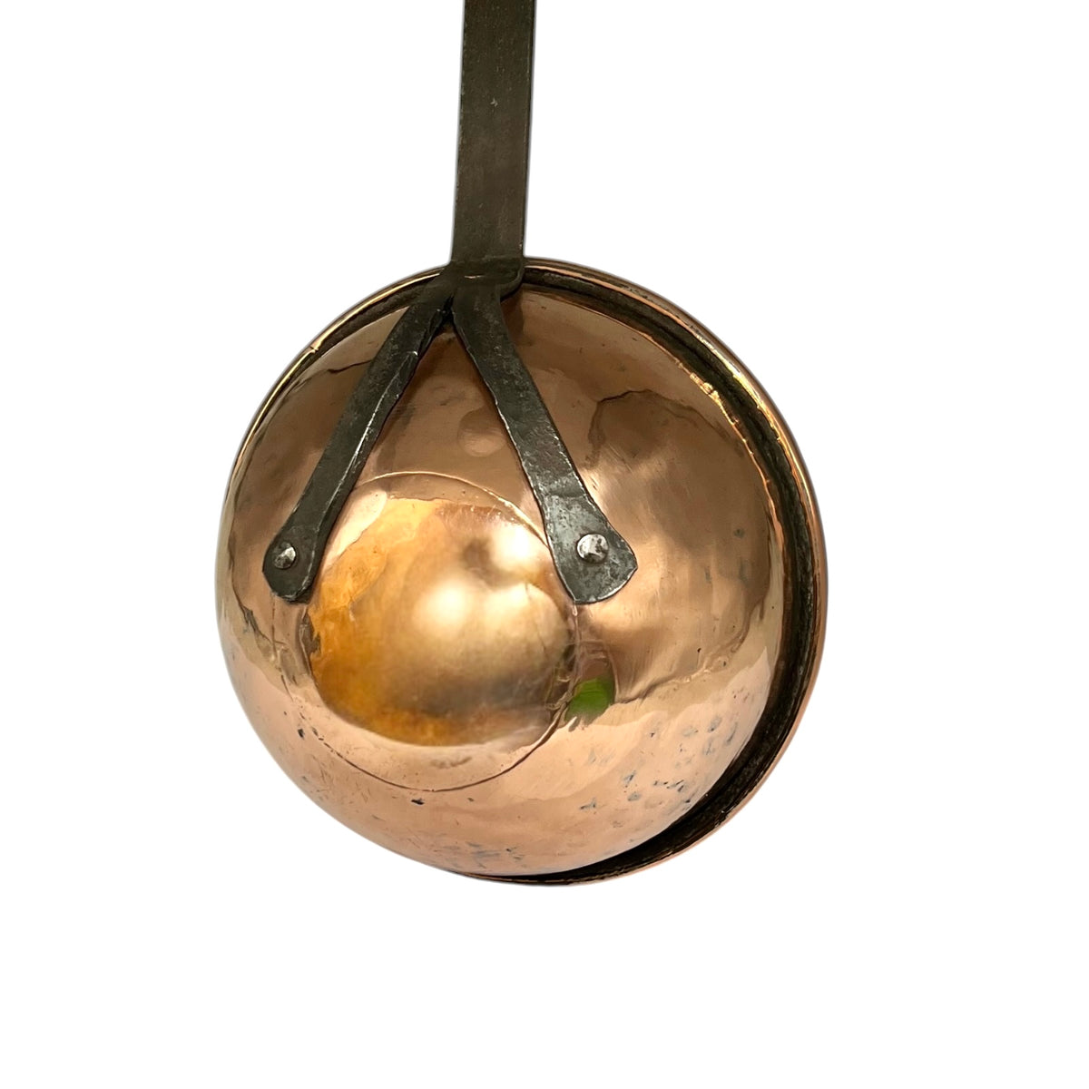 A hammered copper ladle with a dark metal hanging strap and brackets, shown against a plain white background.