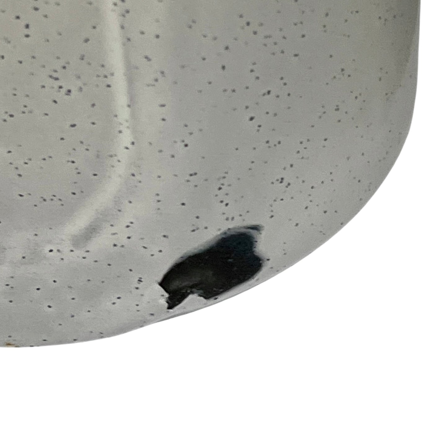 Close-up of a enamel planter with speckled pattern on a white background