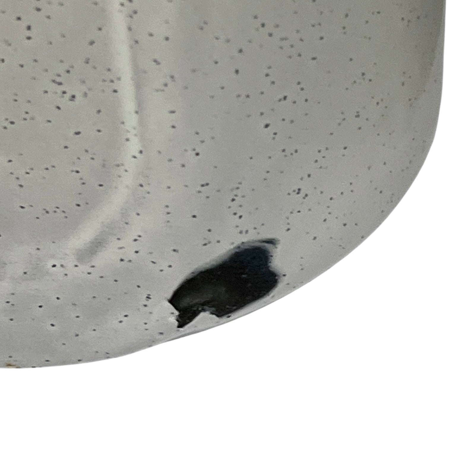 Close-up of a enamel planter with speckled pattern on a white background