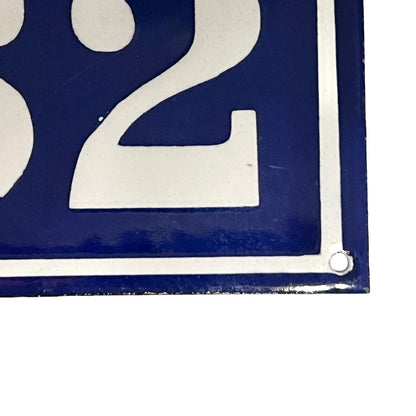 Close-up of a blue and white number '2' sign