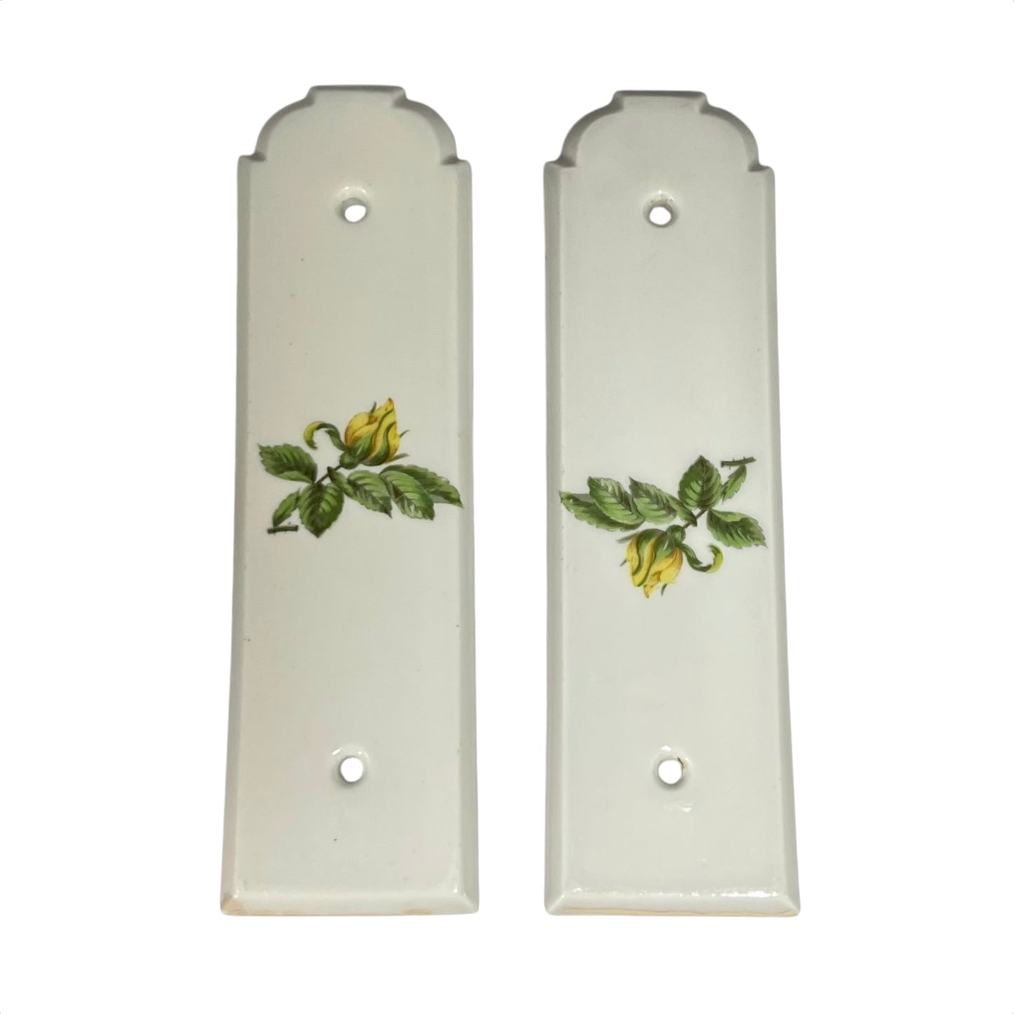 Two ceramic finger plates with floral designs on a white background
