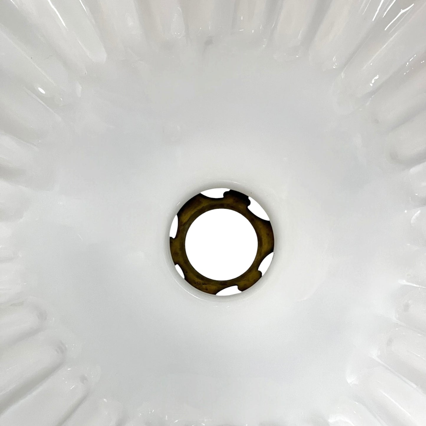 Close-up of a white milk glass lamp shade interior