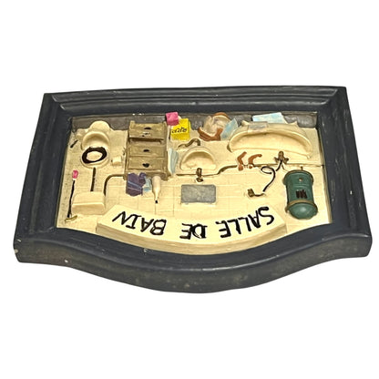 Close-up of a vintage bathroom door sign on a white background