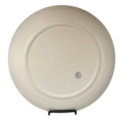 White ceramic plate with a logo on a white background