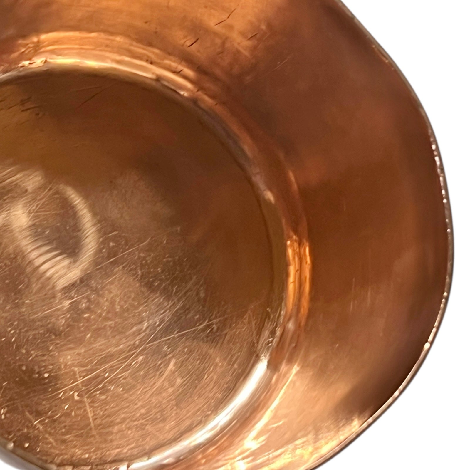 rim of copper sugar pan