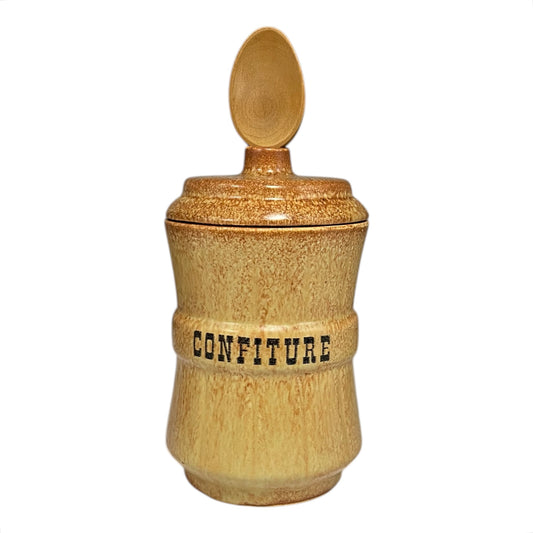 Ceramic confiture jar with a lid on a white background