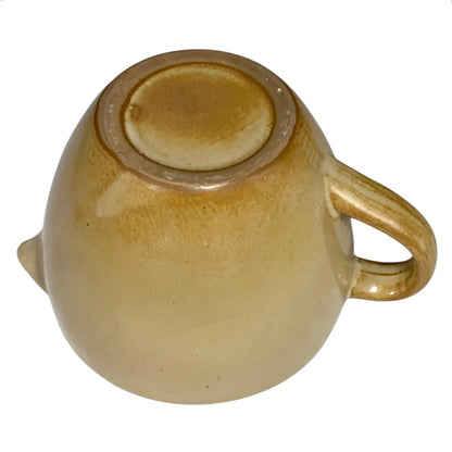 Base view of ceramic pitcher on a white background