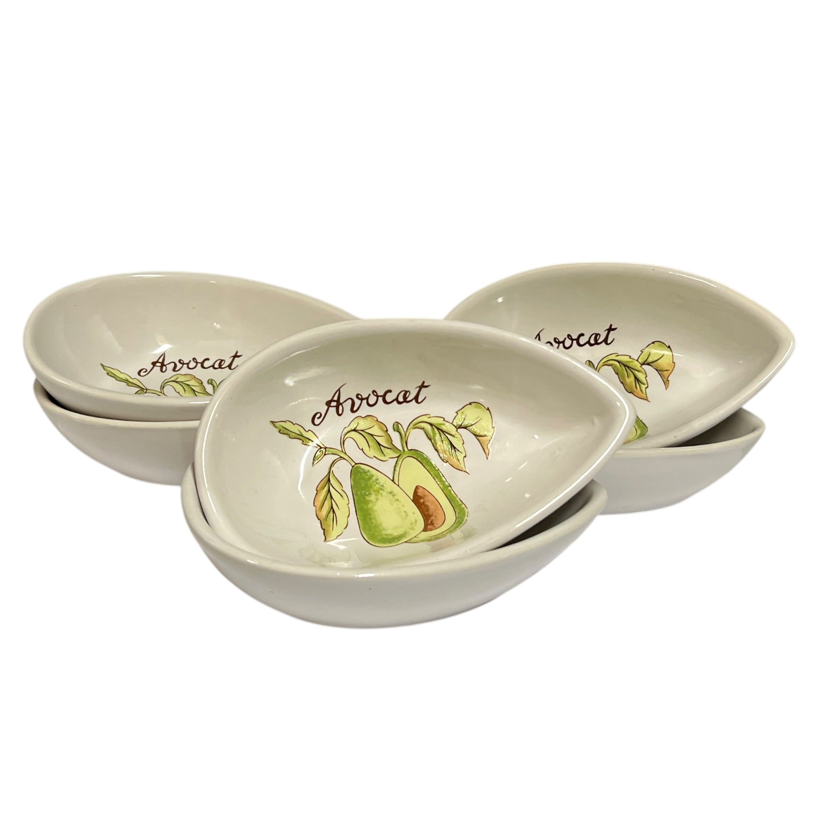 6 white ceramic avocado-shaped serving bowls with green and yellow avocado illustrations and the word 'Avocado' printed inside, arranged on a white background.