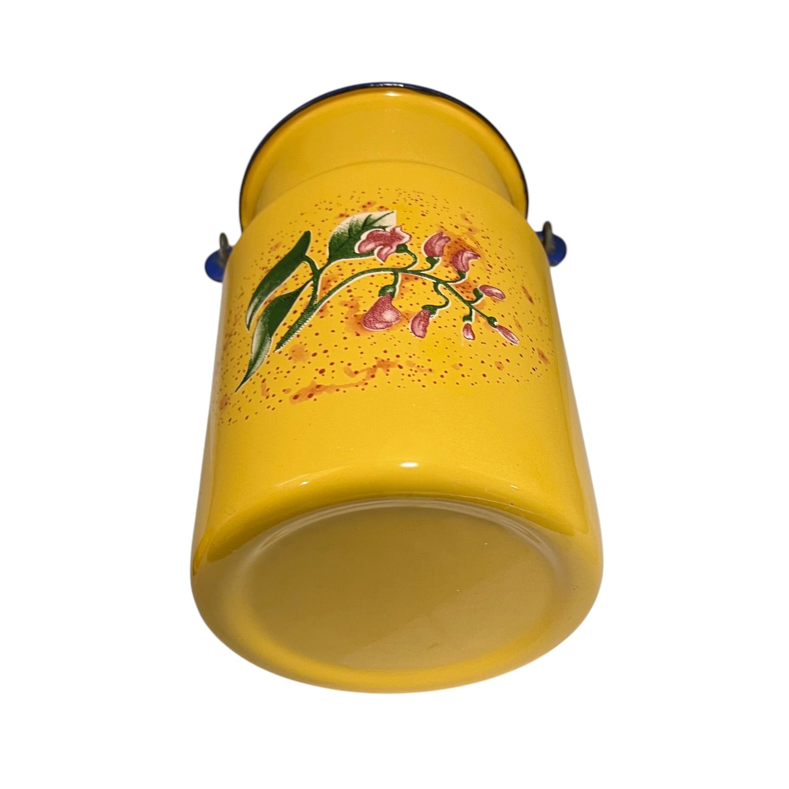 A yellow enamel churn with a floral design of pink flowers and green leaves on the side, shown against a plain white background.