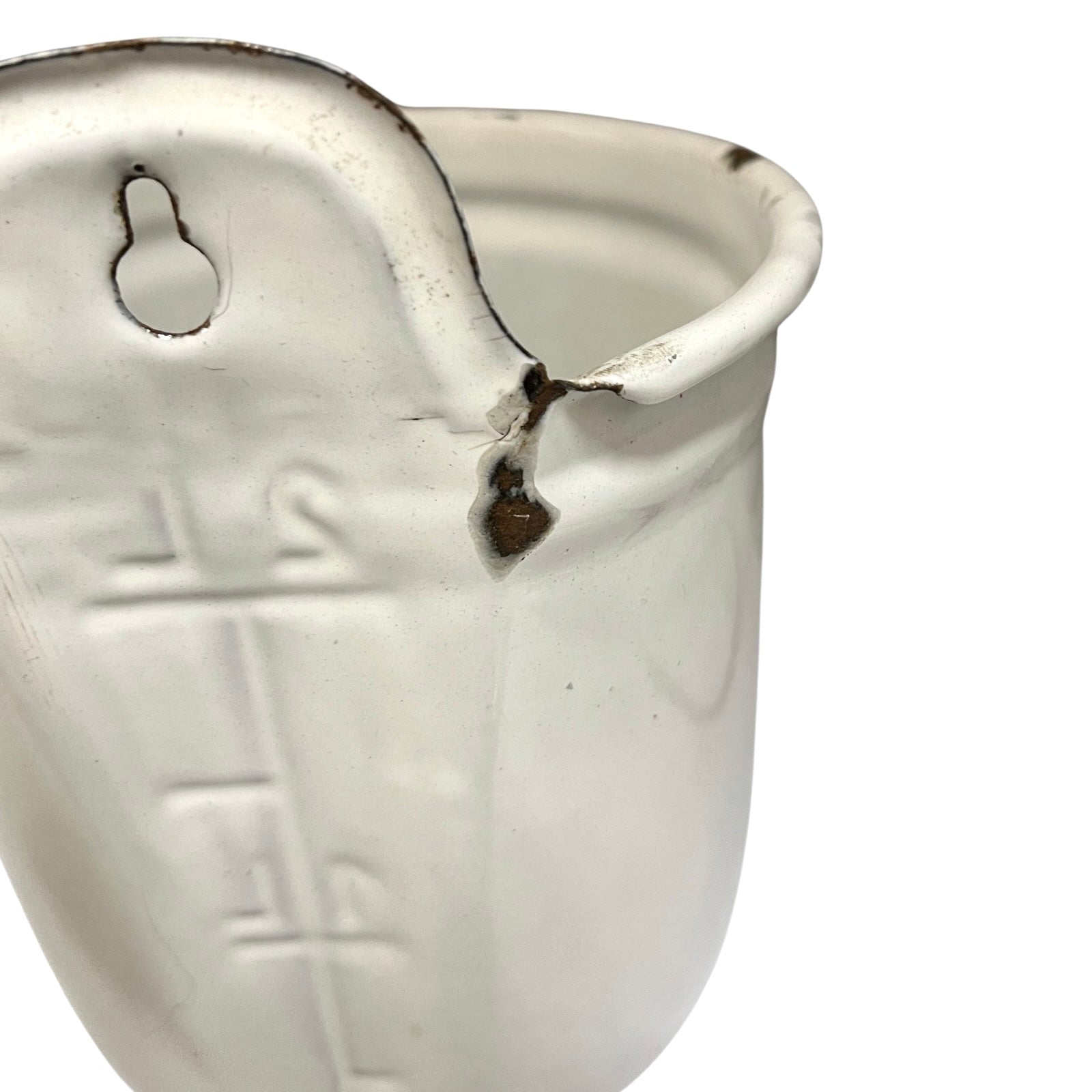 A white  measuring cup with embossed measurement markings and a small hanging loop, shown on a plain white background.