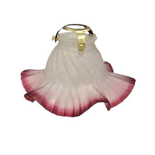 Decorative glass light fixture with gold accent on a white background