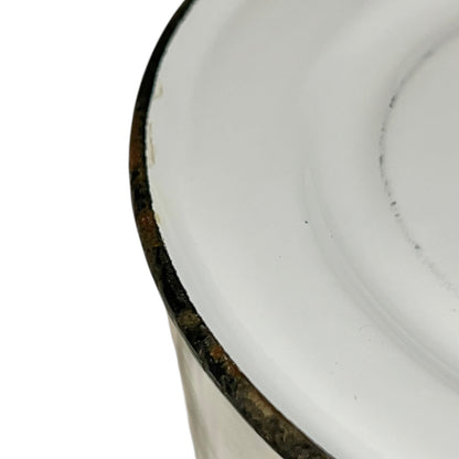 Close up of an enamel coffee pot on a white background