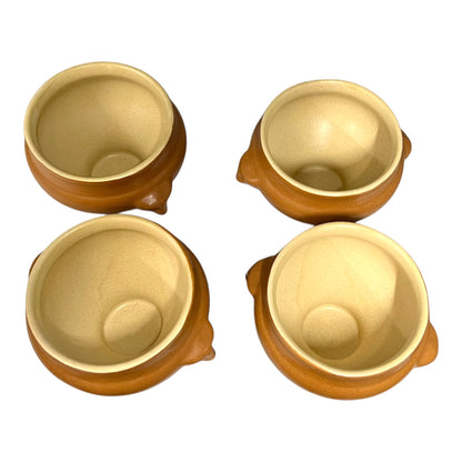 set of 4 light brown ceramic French soup bowls with lions head handles on a white background 