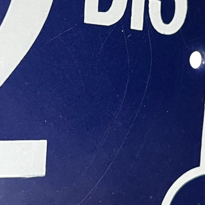 Close up of a French enamel door number 32 on a white background 