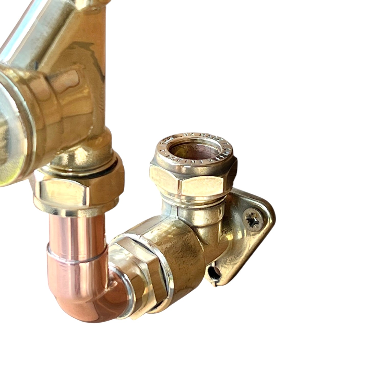 close up of copper and brass tap fitting on a white background 