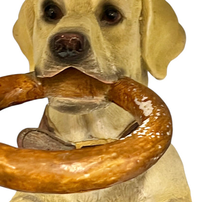 Dog shaped umbrella stand with a wooden ring on a white background