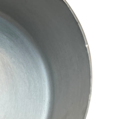 rim of aluminium lined copper pan