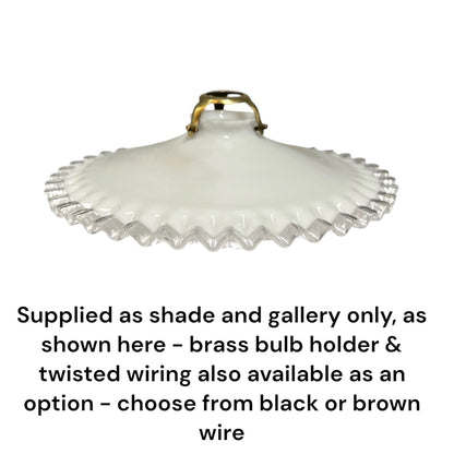 A white glass shade with a scalloped edge and a brass-colored bulb holder at the top, shown on a white background with text below stating that brass bulb holder and twisted wiring are available as options, and black or brown wire can be chosen.