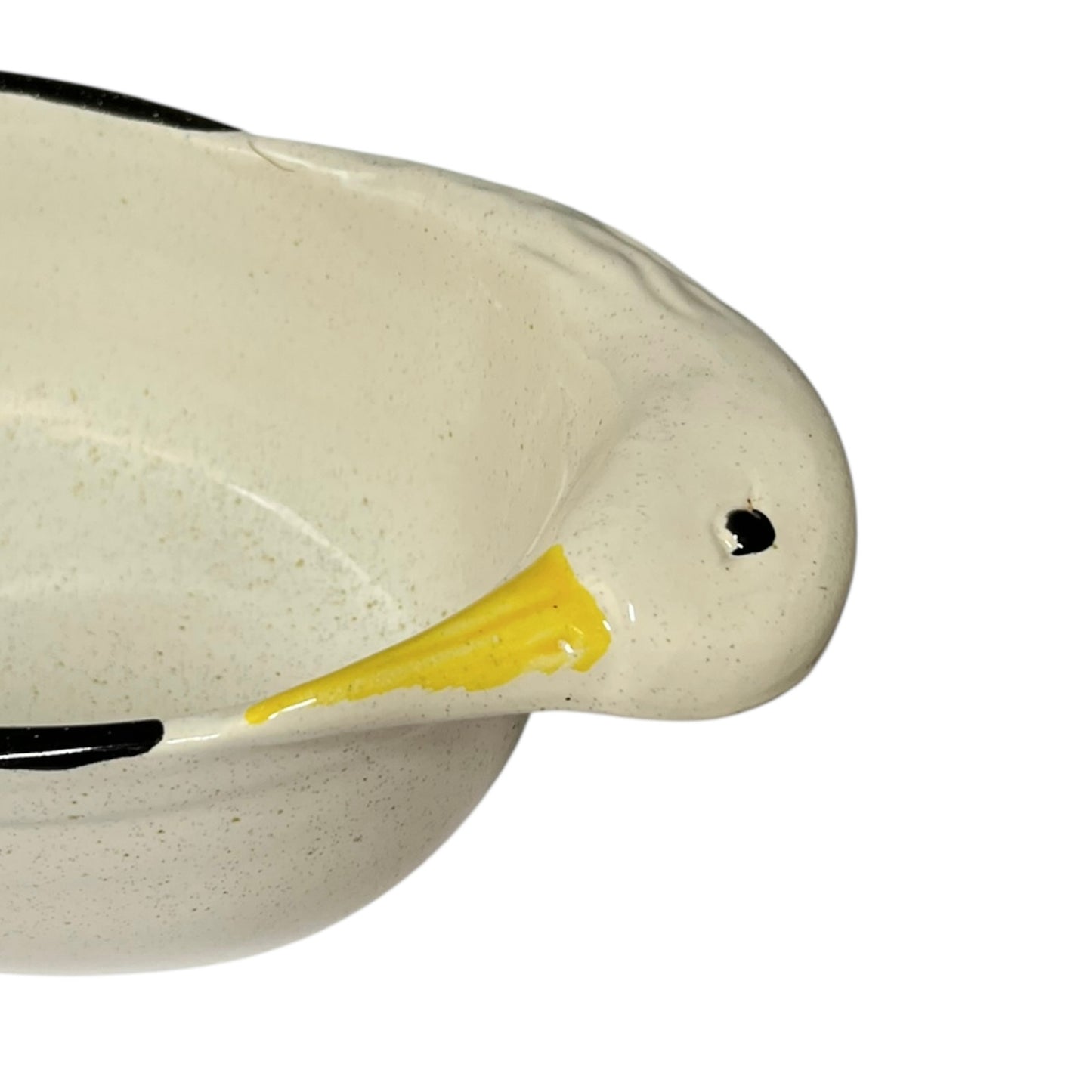 Close-up of a ceramic duck dish  with a yellow beak on a white background