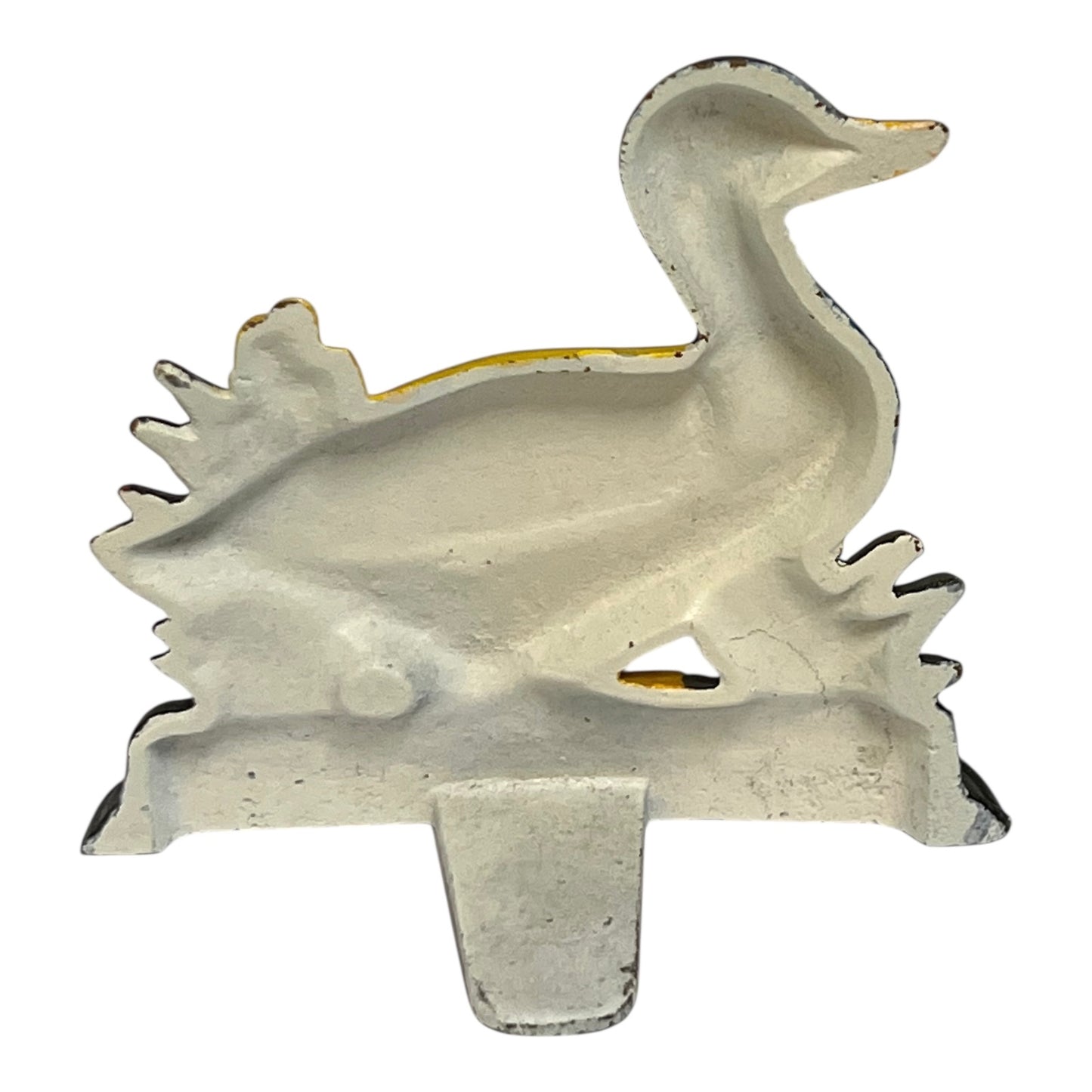 Close up of cast iron doorstop on a white background