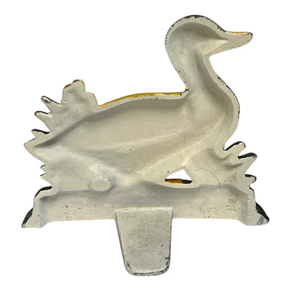 Close up of cast iron doorstop on a white background