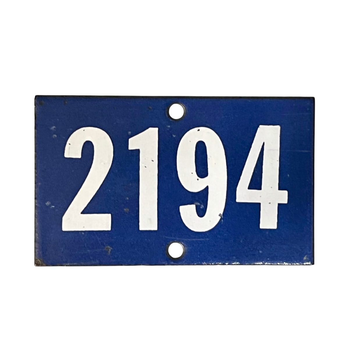 A rectangular blue metal house number plaque with the white numbers '2194' and two mounting holes, shown against a plain white background.