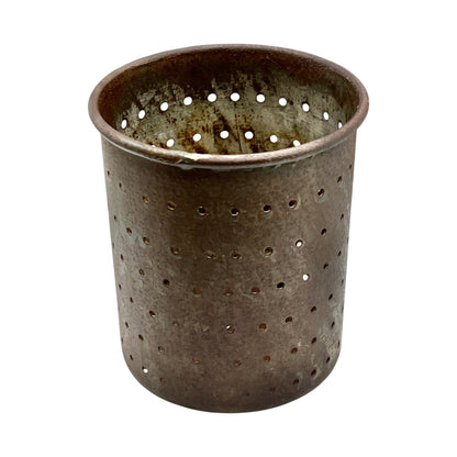Close-up of a vintage French fruit press with an enamel pot on a white background