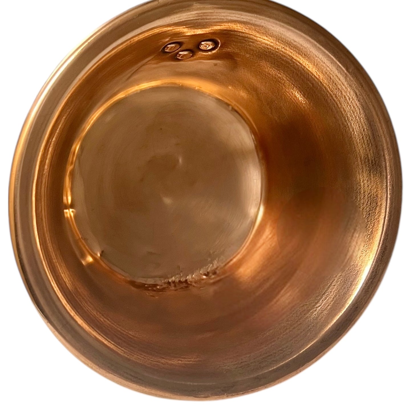 Close up of French vintage copper ladle pan with a black handle on a white background