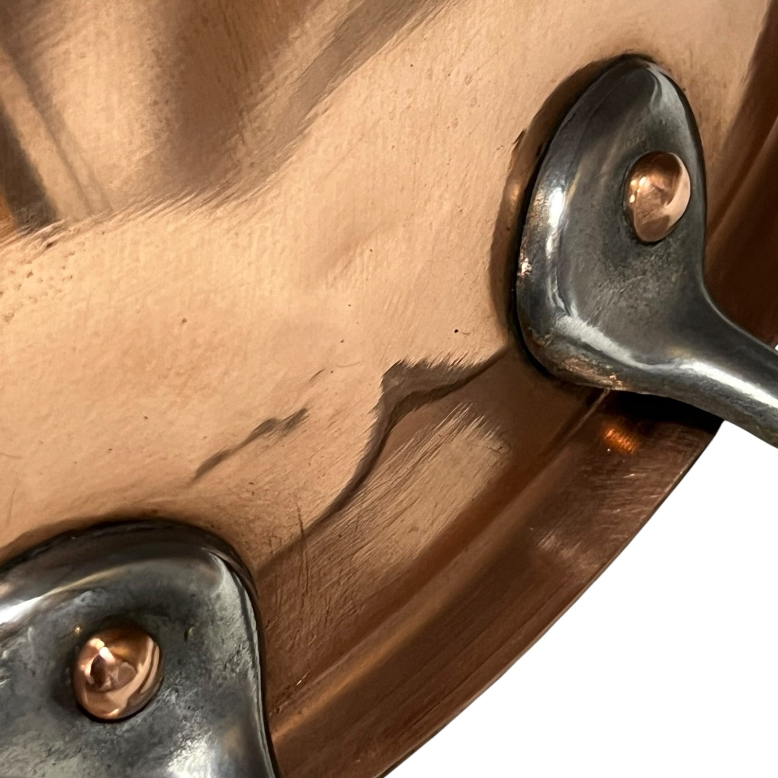 Close up of a French copper bathroom basin on a white background
