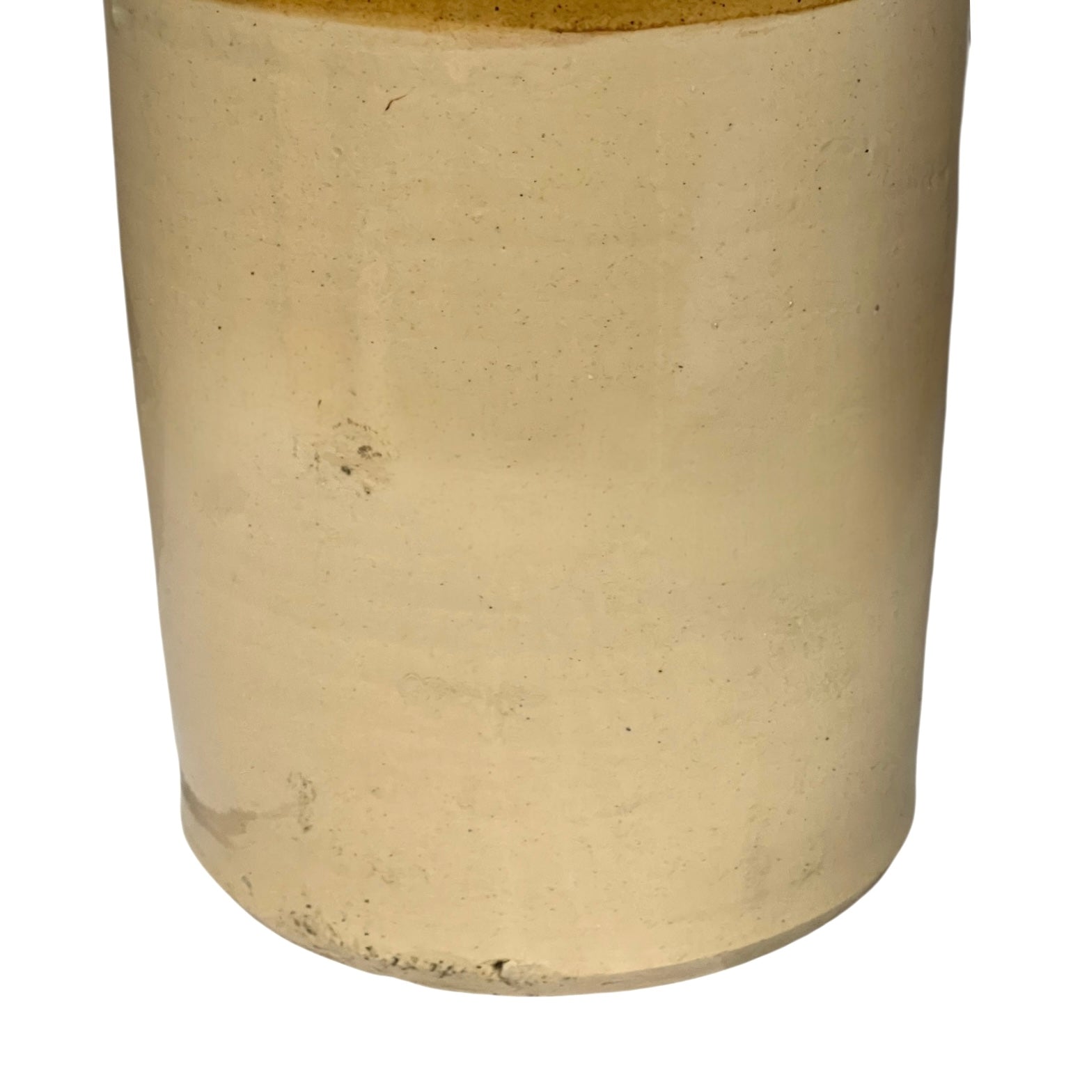 Close up of a beige cylindrical WW1 jar on a white background