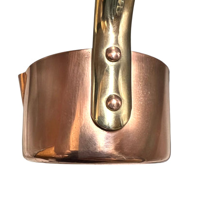 French copper ladle with a brass handle  on a white background