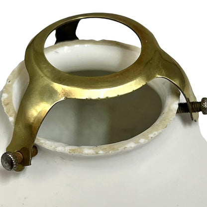 White round vintage glass lampshade with a frilled clear edge and a brass collar on a white background