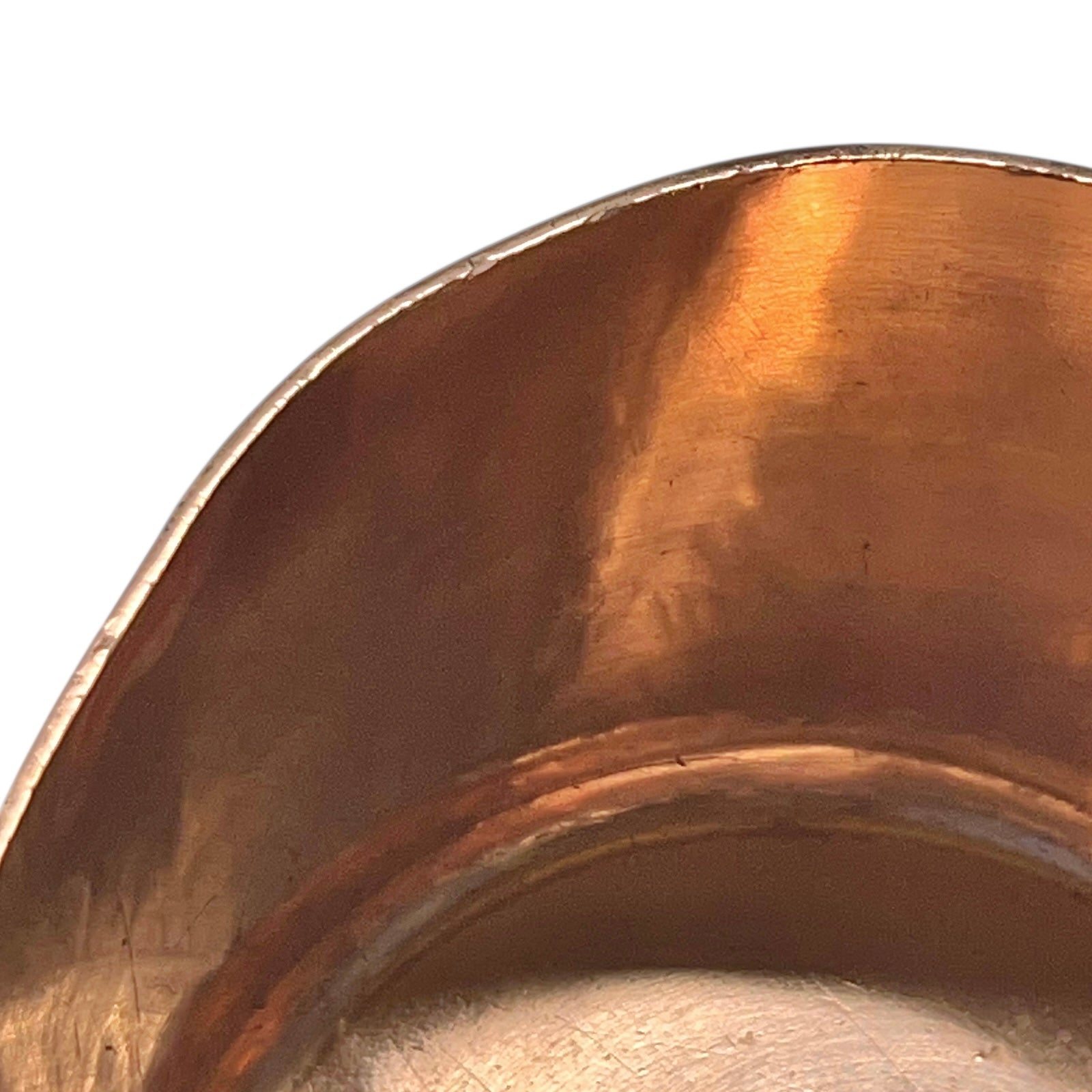 top edge of copper sugar pan