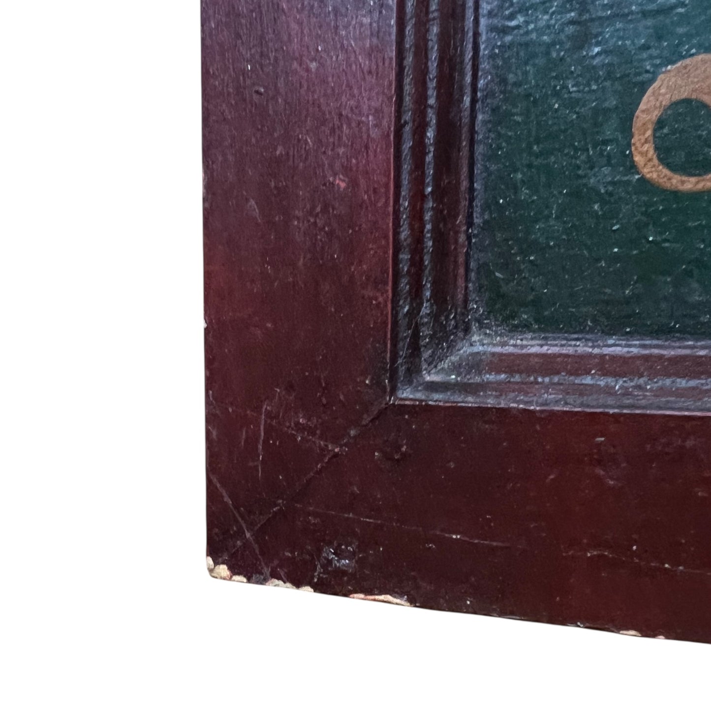 Corner of a dark wooden frame with a greenish backgroundground