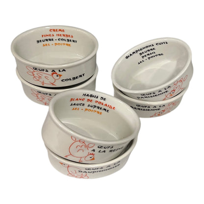 Set of white ceramic bowls with French text and illustrations on a white background