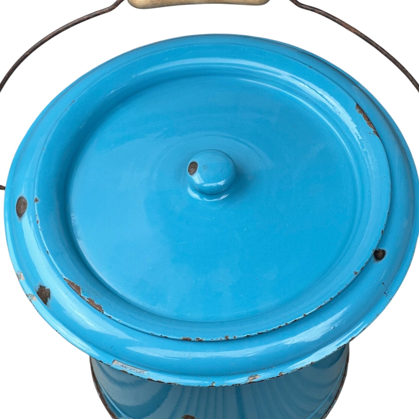 Blue metal bucket with a wooden handle on a white background
