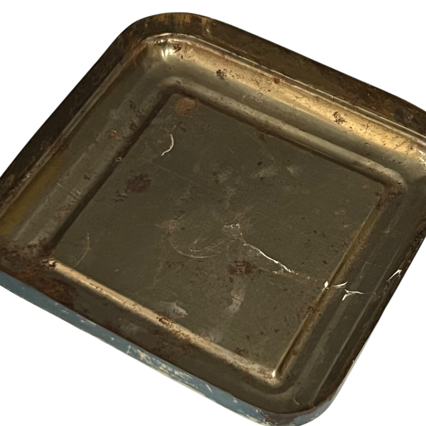 Vintage tin can with a colourful design featuring a face and 'Banania' branding on a white background.