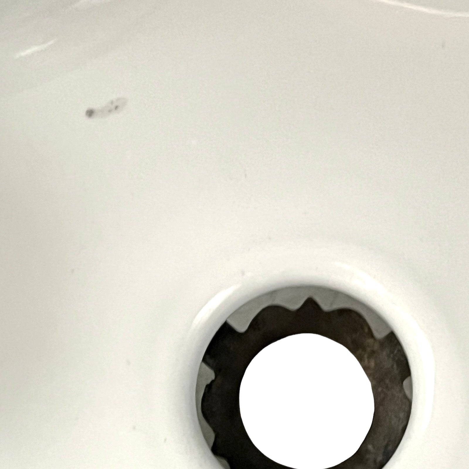 Close up of vintage blue glass lamp shade with brass fitting on a white background