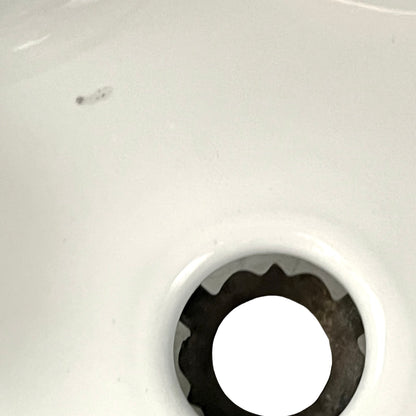 Close up of vintage blue glass lamp shade with brass fitting on a white background