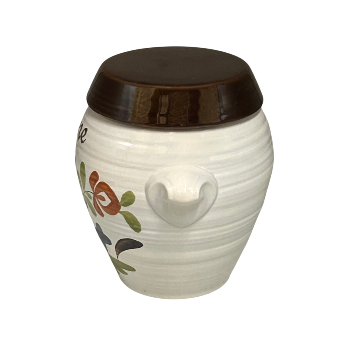 A white ceramic jar with a dark brown lid, featuring a decorative floral pattern and a small protruding handle on the side, set against a plain white background.