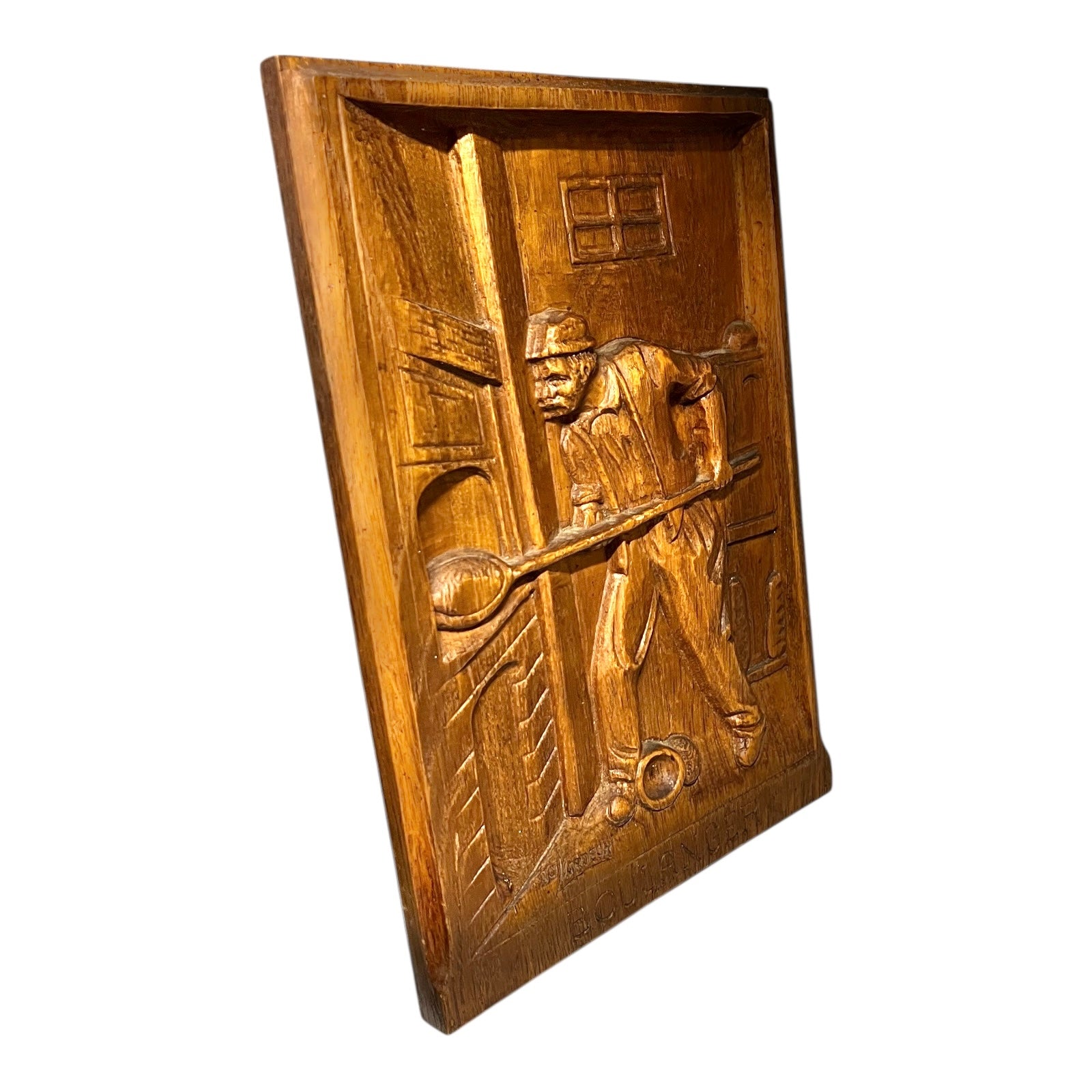 Side view of a wooden engraved panel picture on a white background