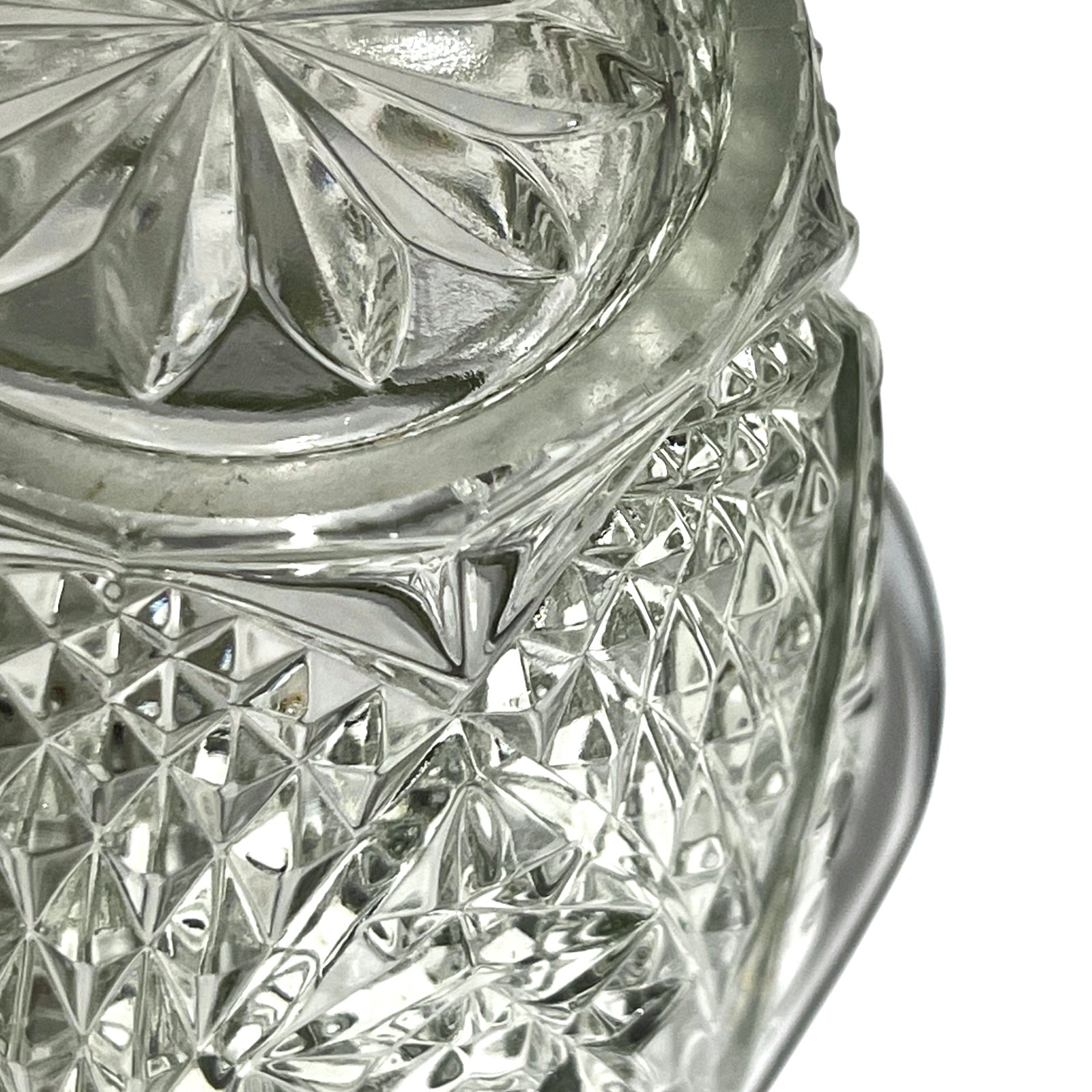 Close up of a decorative glass vintage ice bucket on a white background