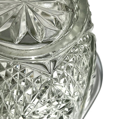 Close up of a decorative glass vintage ice bucket on a white background